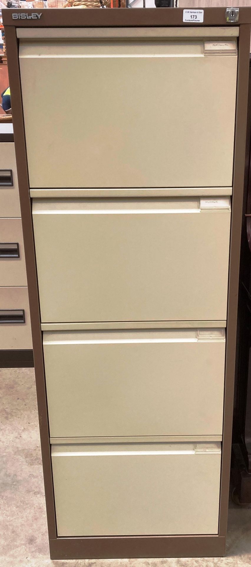A Bisley brown and beige metal four drawer filing cabinet