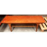 A teak coffee table with undertray 122cm x 40cm