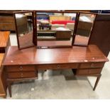 A Stag dark mahogany finish mirror back five drawer dressing table 154cm