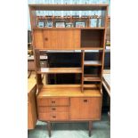 A Wolfe and Hollander teak room divider with open shelves and single sliding door over three