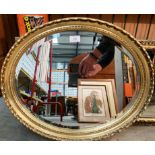 Oval ornate gilt framed mirror,