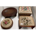 An oval stool with brown leather top on bun feet and three other stools with tapestry tops (4)