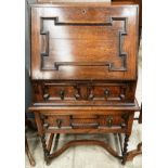 A 1930's oak bureau with fall flap over two drawers 60cm x 114cm high