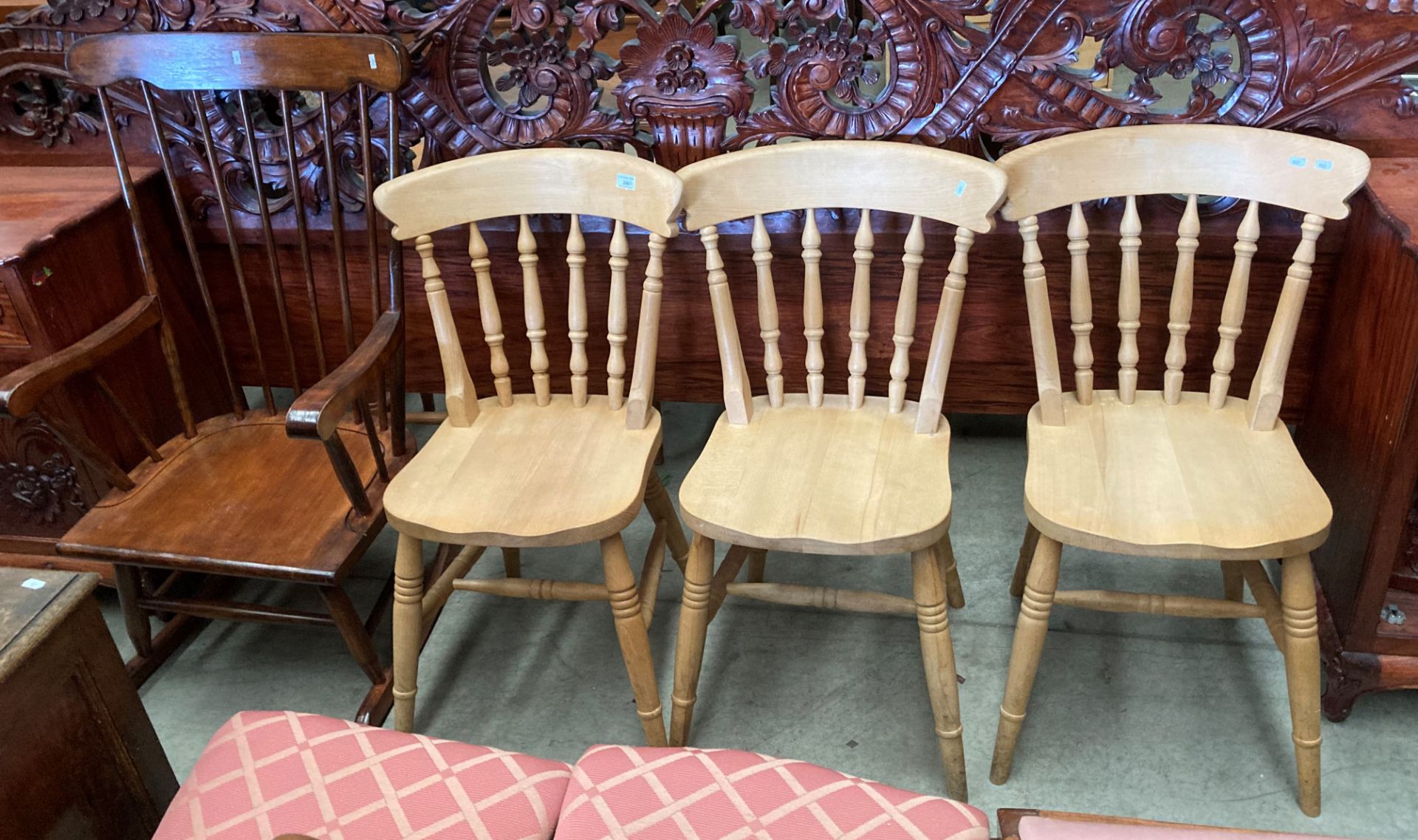 Three modern pine rail back kitchen chairs and a stained wood rocking chair (4)