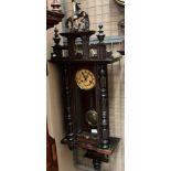 A mahogany cased Vienna style wall clock complete with key approximately 120cm