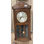 An oak cased wall clock 72cm