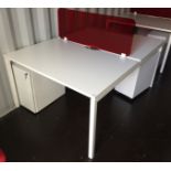 White steel framed double sided desk pod with two 3 drawer white metal mobile pedestals and a red