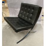 A KNOLL STUDIO BARCELONA CHAIR with padded black leather upholstery on chrome frame 75cm wide,