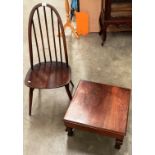 An Ercol dark stained elm rail back dining chair and a mahogany finish low table (2)