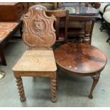 An oak carved back hall chair complete with a walnut circular coffee table 60cm