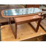 A teak framed wall mirror and a teak coffee table (2)