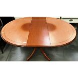 A Morris Furniture Company model 442 teak oval extending dining table (the extending section and a