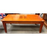 A 2003 medium wood finish coffee table 112 x 60cm