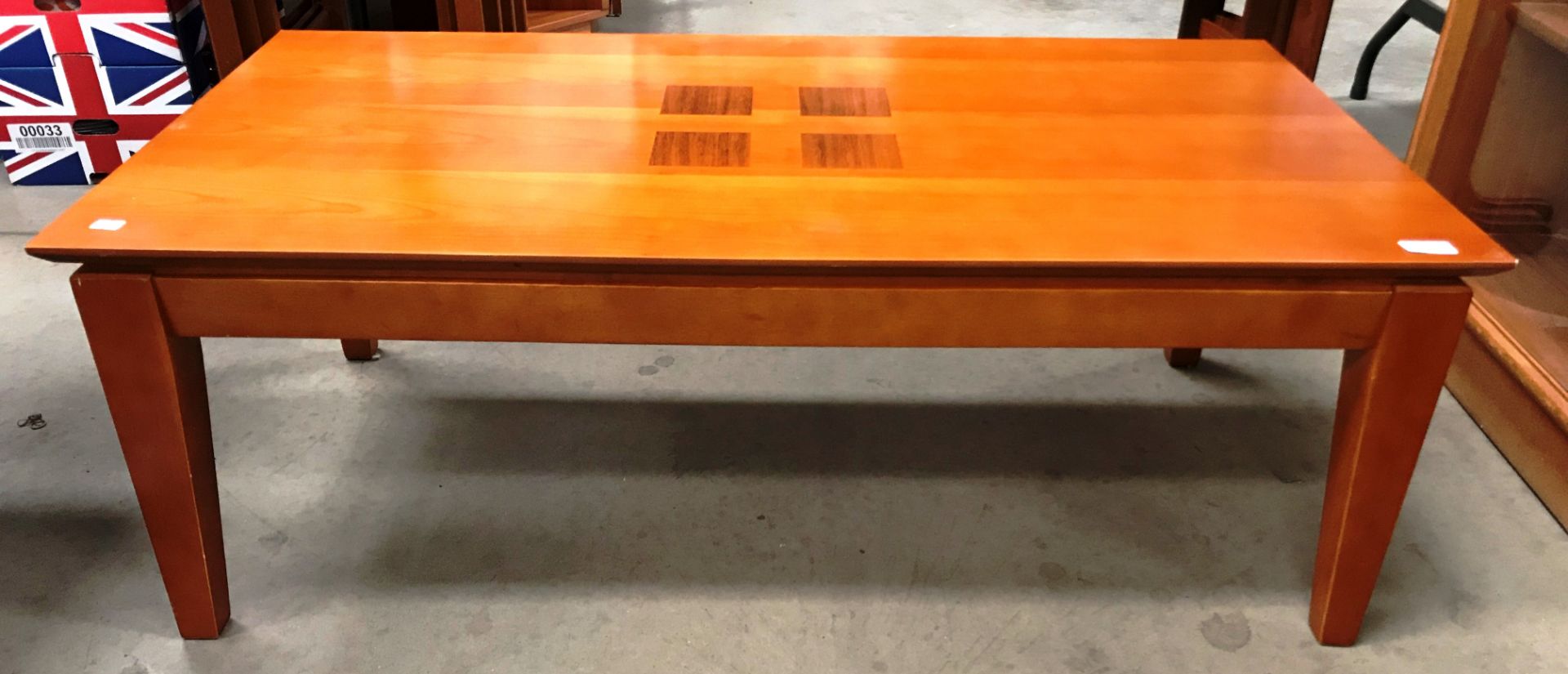 A 2003 medium wood finish coffee table 112 x 60cm