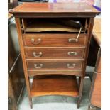 An Edwardian inlaid mahogany four fall front drawer music cabinet (top drawer needs reattaching)