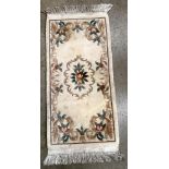 Three small Chinese rugs two fawn/beige patterned,