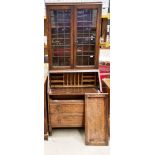 An oak bureau bookcase with leaded glazed doors over fall flap three drawer base 76 x 196cm high