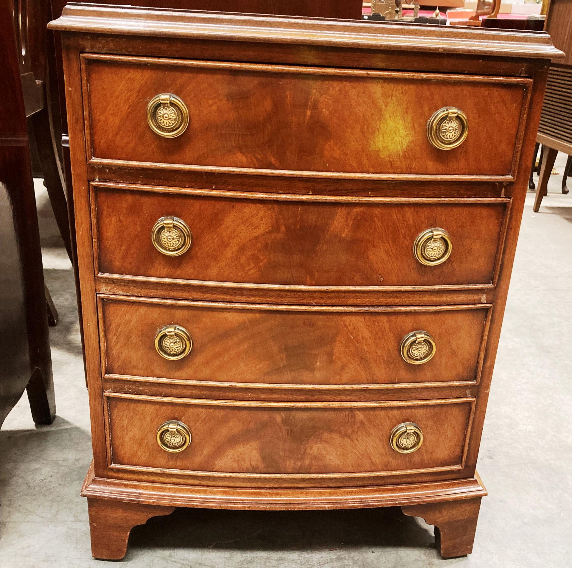 A small mahogany bow front chest of four drawers 45 x 62cm high