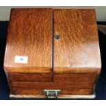 An oak stationery box with cut glass inkwell and key with dividers and pull out drawer 30 x 16 x