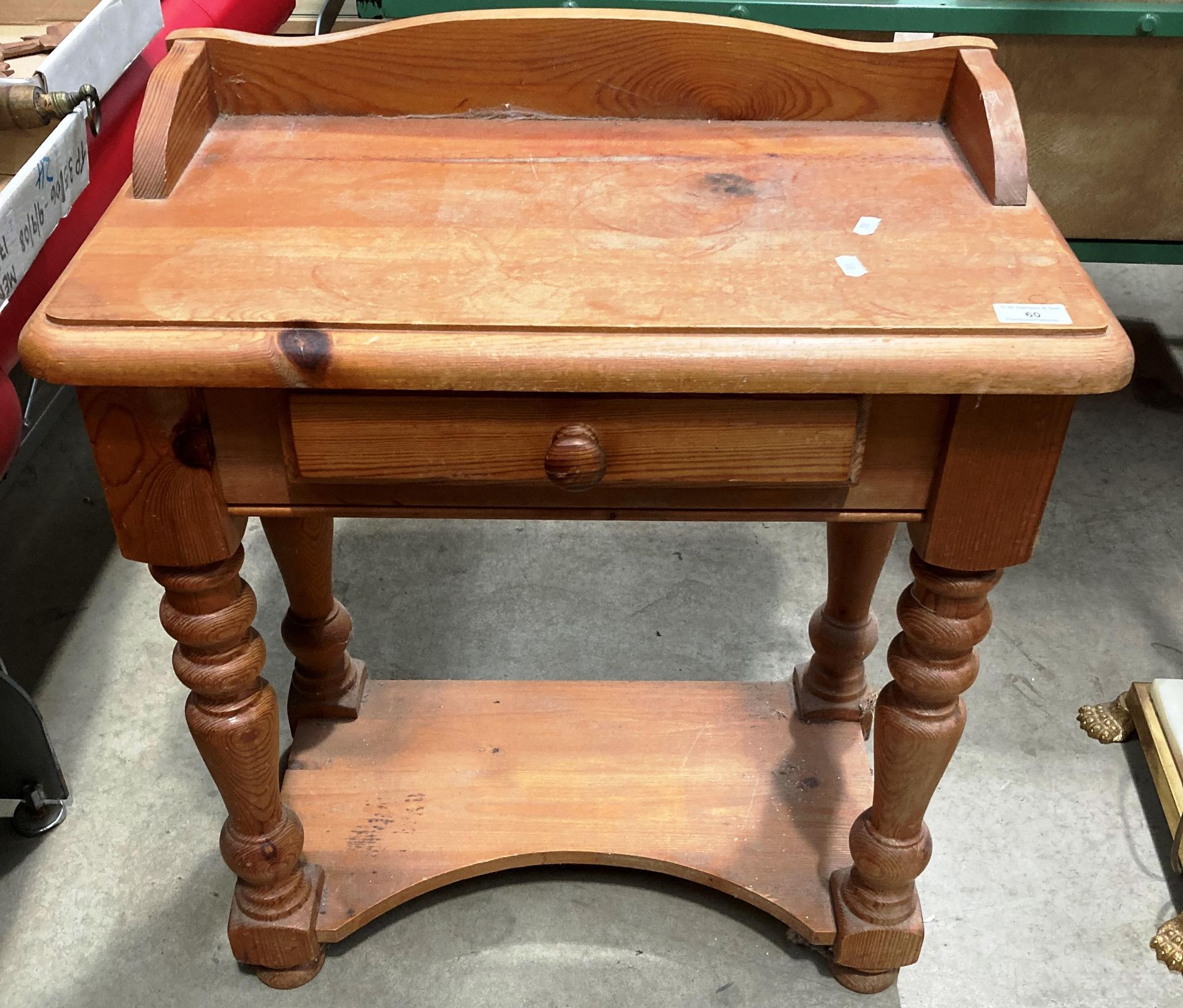 A reproduction pine side table with frieze drawer 60cm