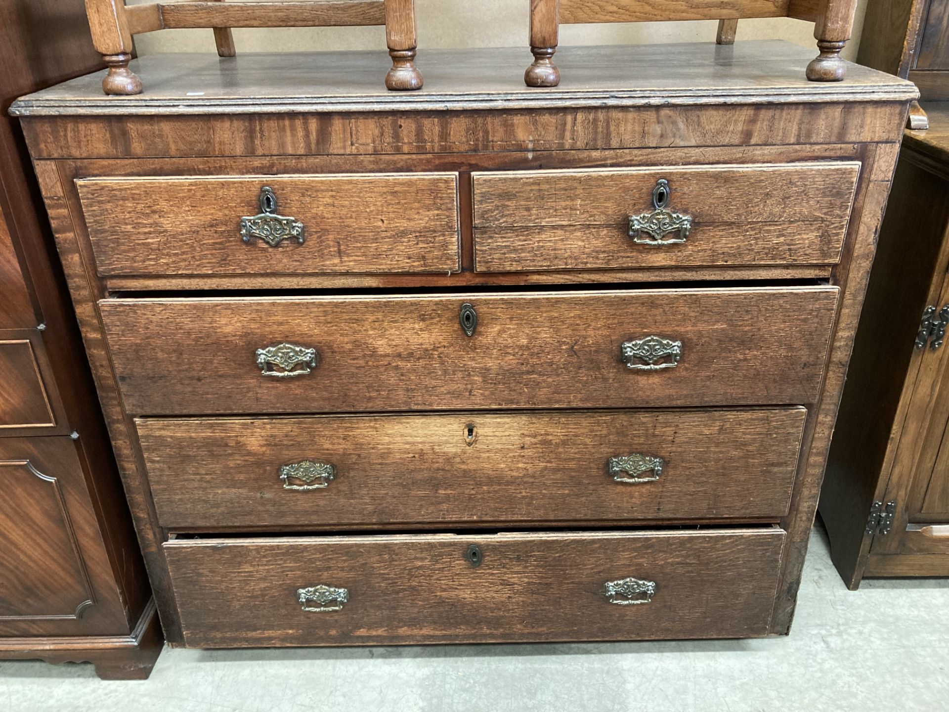 An oak 19th century five drawer chest of drawers - three long,