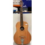 An Elbazzini six string acoustic guitar 97cm marked and in need of some sympathy