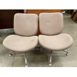A pair of Orangebox Model Track - 02 beige upholstered swivel chairs on four star chrome cases