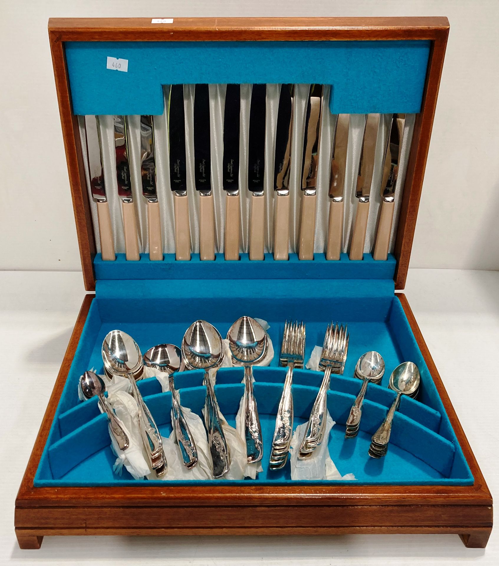 A wooden canteen of cutlery containing fifty eight pieces of Moss Rose plated and Smith Seymour