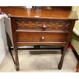 A Heathland Furniture two drawer shaped side stand 102cm max