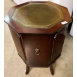 A mahogany single door octagonal side cabinet 45cm with tooled green leather effect top