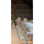 A brown ribbed glass chemist's bottle and a small quantity of other glassware