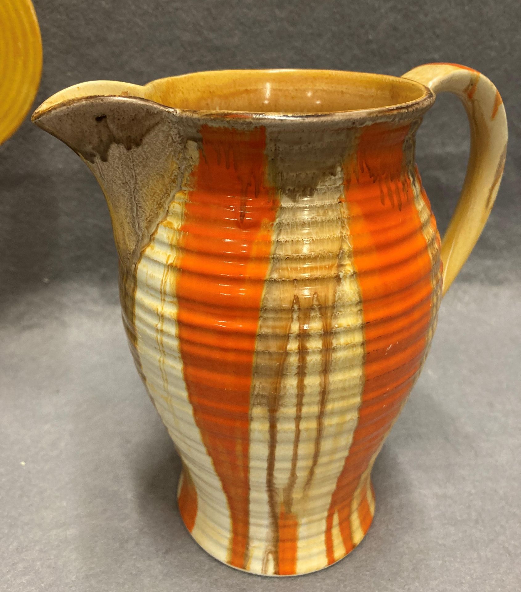 A Shelley jug in orange, yellow and brown, together with a Wadeheath jug with floral decoration, no. - Image 2 of 5