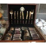 44 piece Canteen of gold coloured wooden handled cutlery in wooden case.