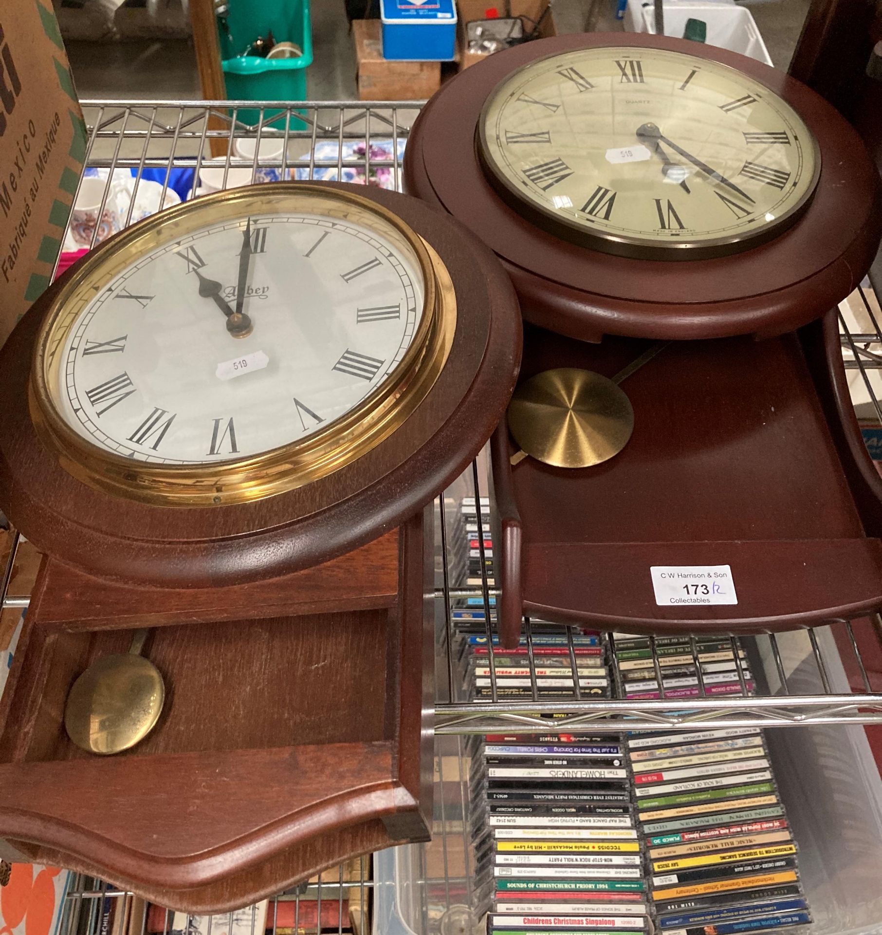 Two modern mahogany finish wall clocks by Abbey and Quartz