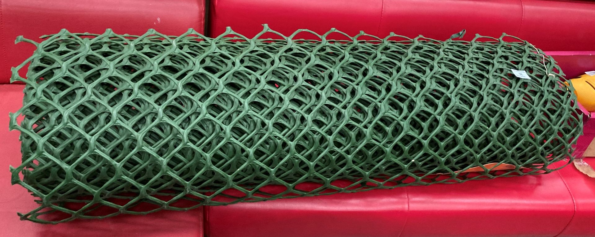 A green plastic heavy duty garden mesh netting roll approximately 10m x 1m
