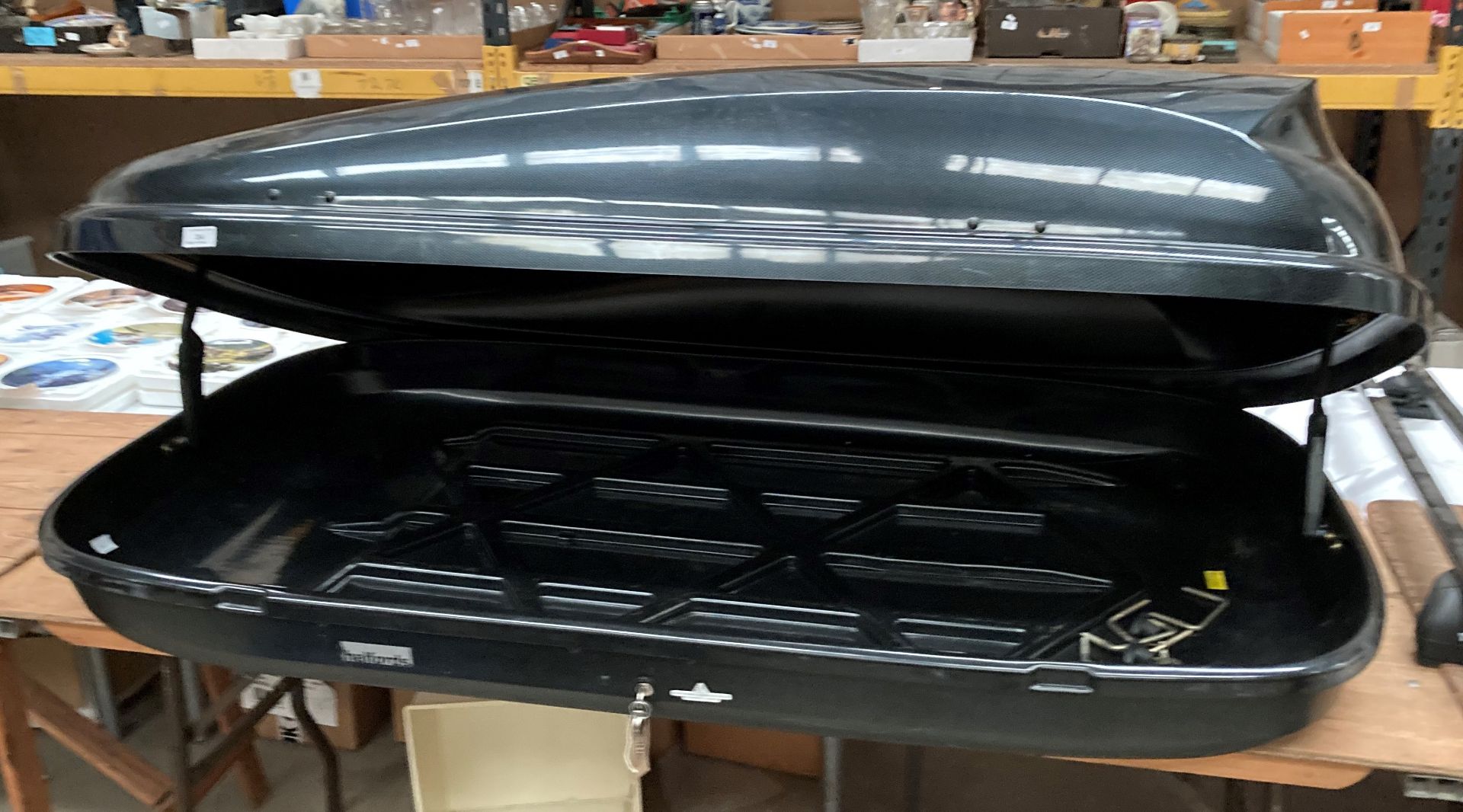 A Halfords black gloss roof box - maximum load 50kg,