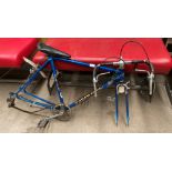 A Puch Pacemaker blue metal racing bike frame with drop handle bars and seat