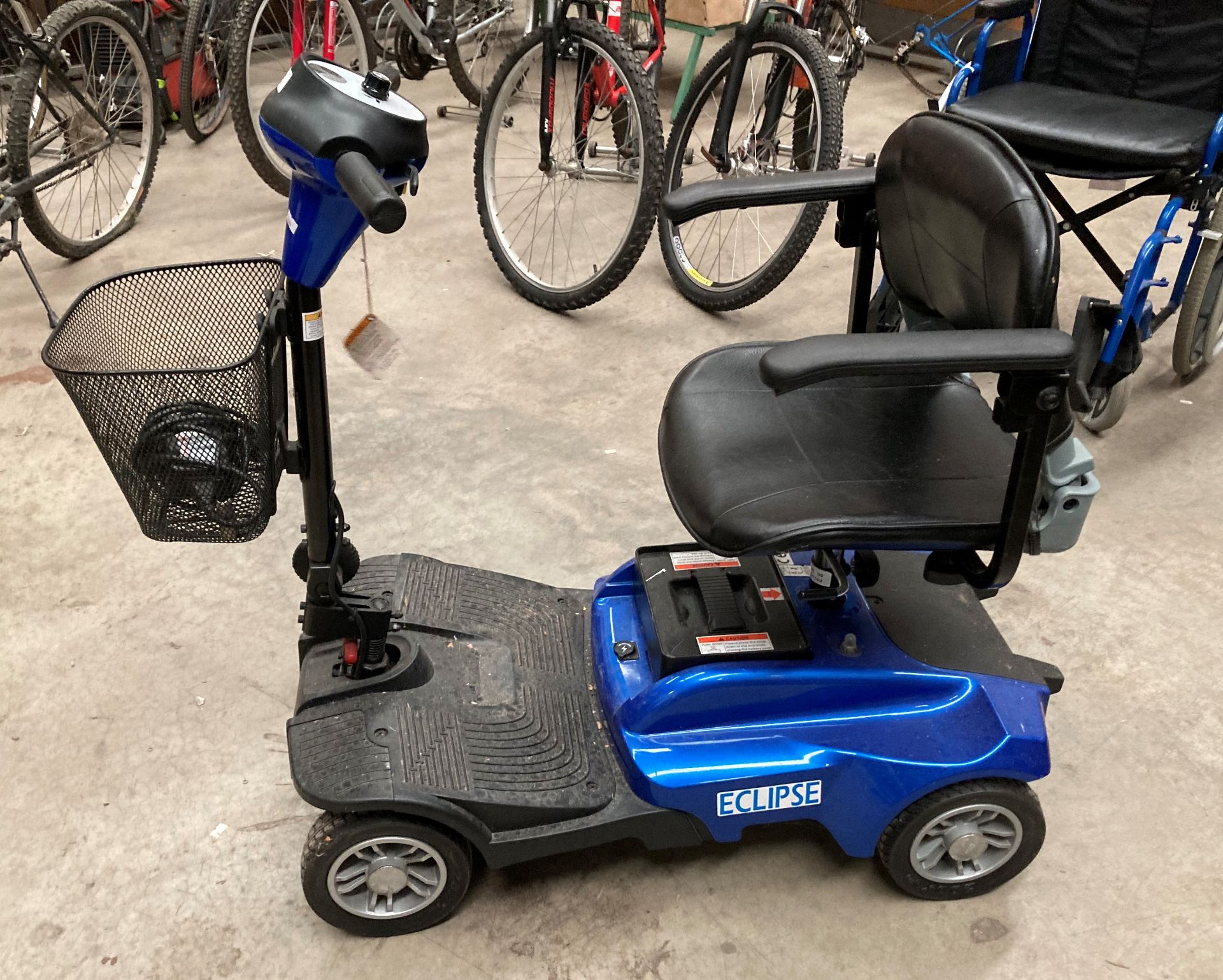 A Care Co Eclipse four wheel mobility scooter in blue complete with charger and key (we have now