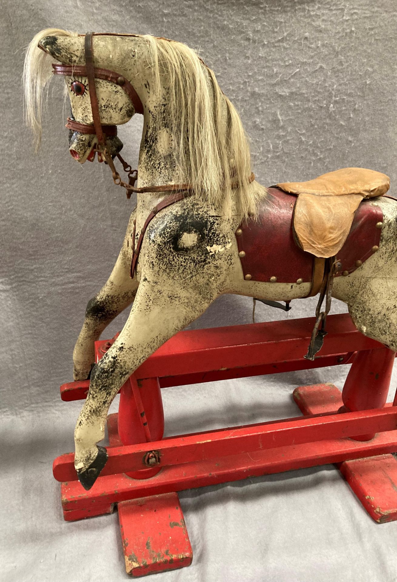 An old dapple grey composition rocking horse on red painted wooden frame, length approximately 80cm, - Image 4 of 12