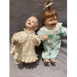 Two assorted porcelain dolls,