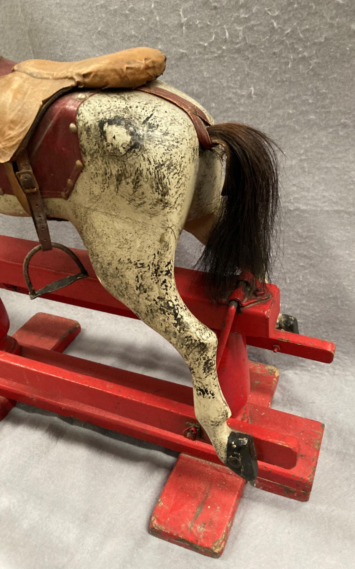 An old dapple grey composition rocking horse on red painted wooden frame, length approximately 80cm, - Image 3 of 12