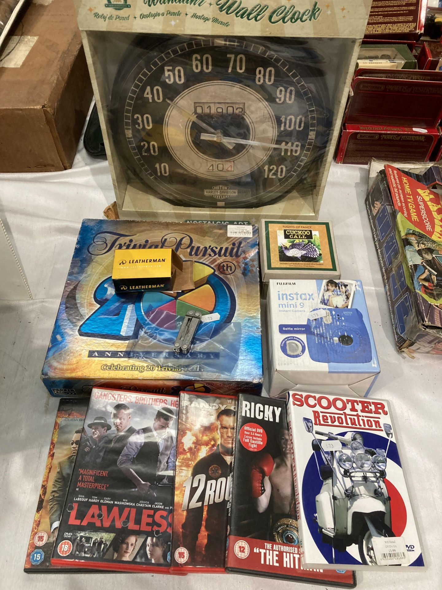 Nostalgic Art Harley Davidson wall clock, Leatherman Micra, Trivial Pursuit game,