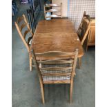 An Ercol blond elm drop leaf dining table 75 x 140cm when extended (please note: top marked and