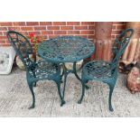 A green painted aluminium three piece patio set comprising circular table 60cm and two chairs