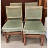 Set of four oak framed dining chairs with green cloth finish seat and backs
