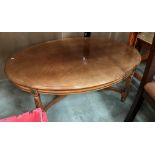 A light mahogany finish oval coffee table 112 x 76cm together with a dining chair (2)