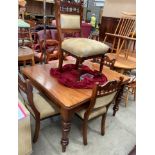 A Victorian mahogany dining table on shaped legs 120 x 105 together with four non matching mahogany