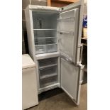 A Hotpoint Airtech Evolution EXFM1718 tall upright fridge freezer