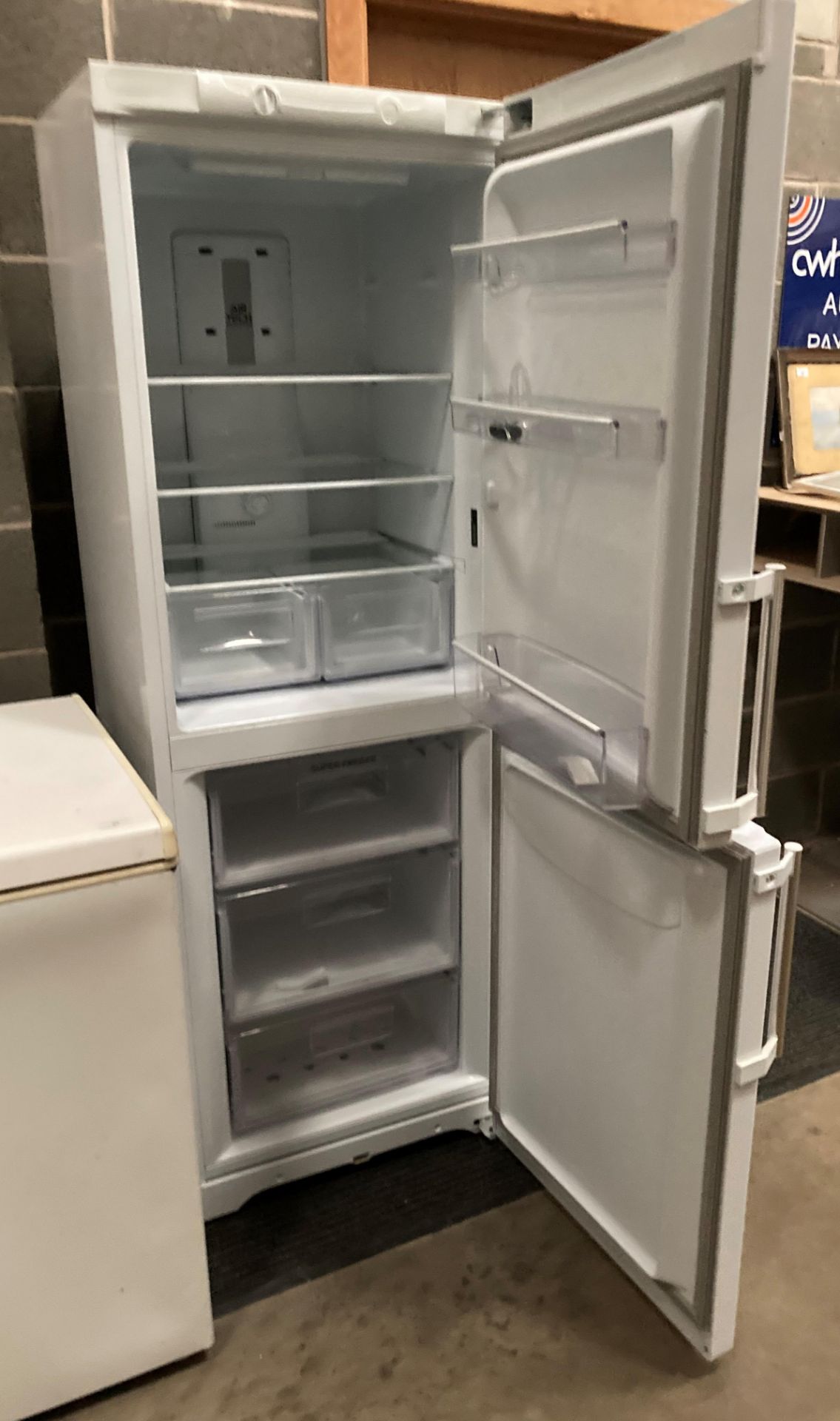 A Hotpoint Airtech Evolution EXFM1718 tall upright fridge freezer