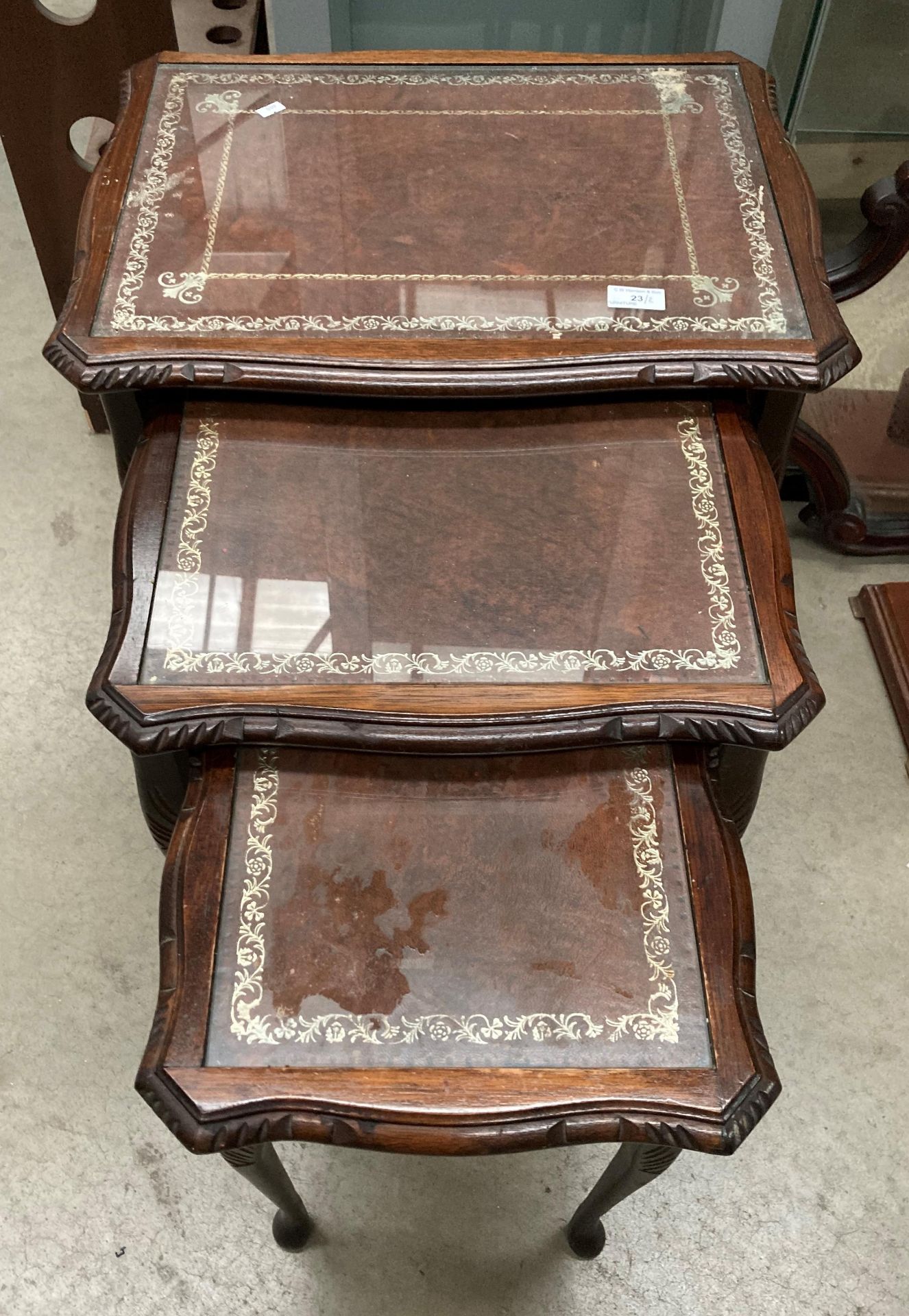 A nest of three coffee tables with brown tooled leather effect tops with inset glass and a small - Image 3 of 3